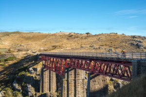 Otago Central Rail Trail Biking over bridge